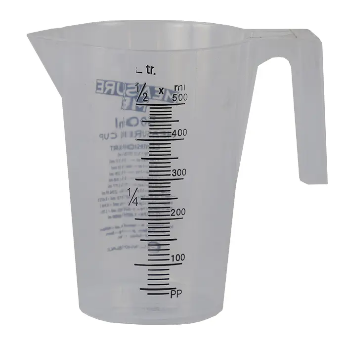 Clear measuring cup with measurement markings.