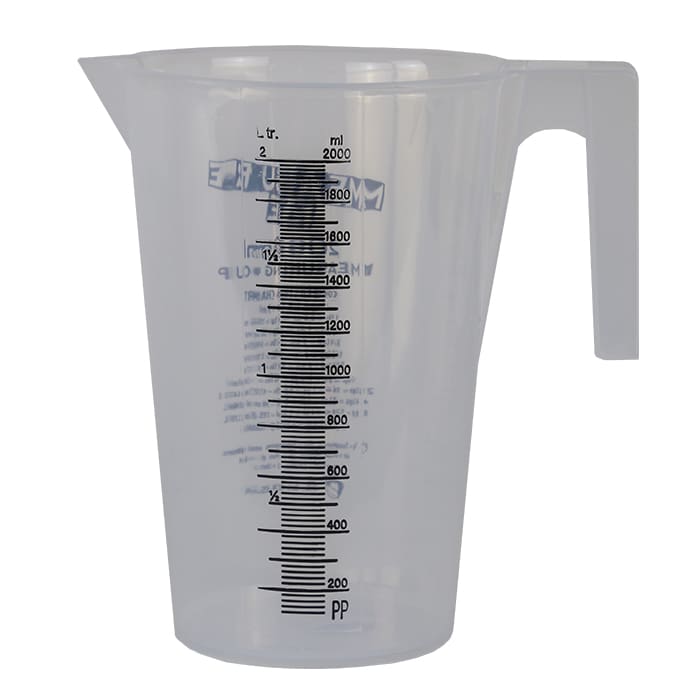 Clear plastic measuring cup with measurement markings.