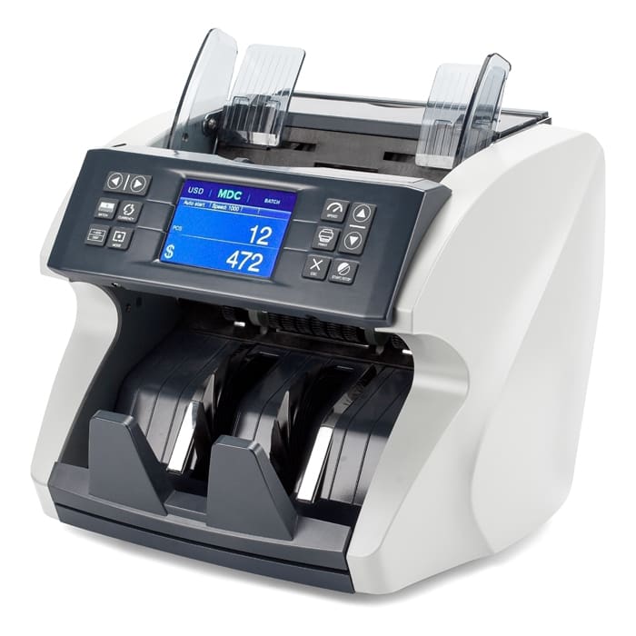 Money counting machine with digital display.