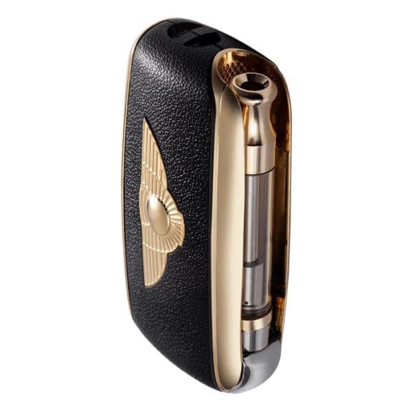 Black and gold vape device with sleek design.