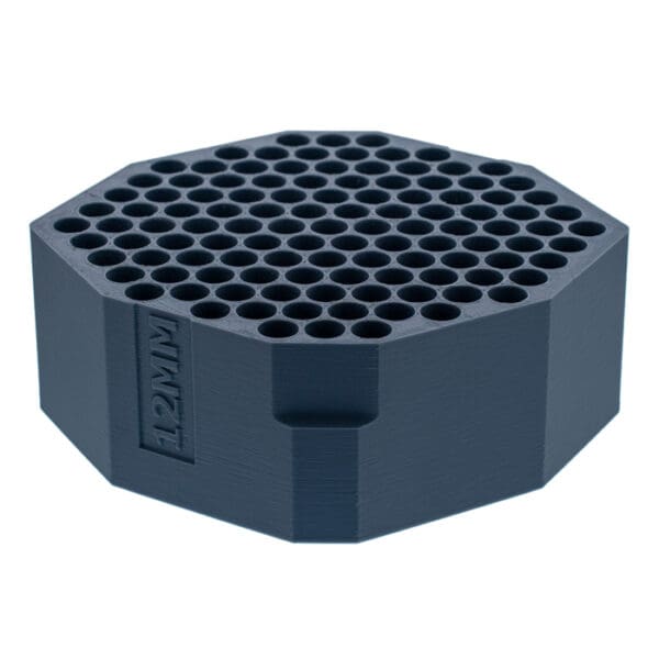 Hexagonal tool holder with multiple holes.