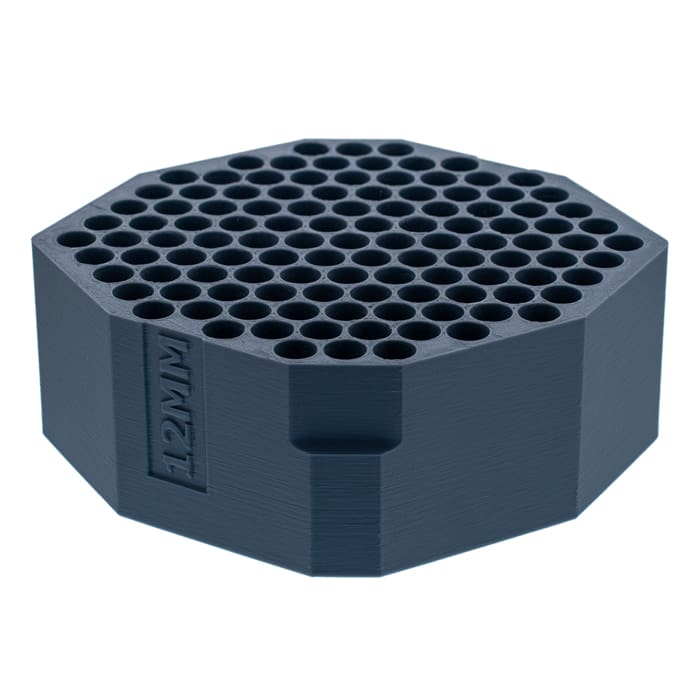 Hexagonal tool holder with multiple holes.