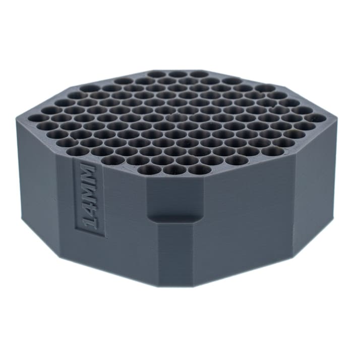 Hexagonal gray item with multiple holes.