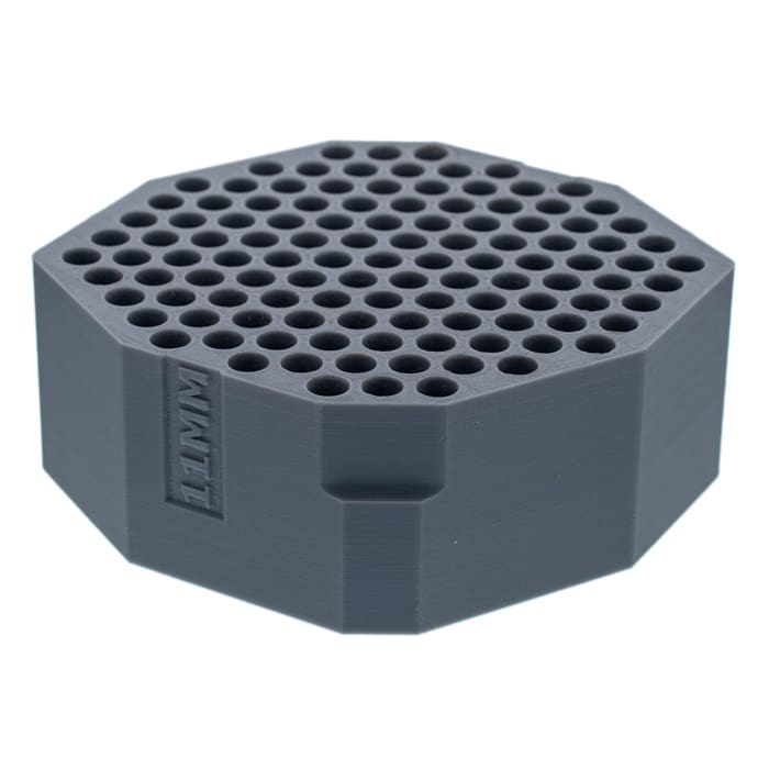 Gray octagonal item with multiple holes.