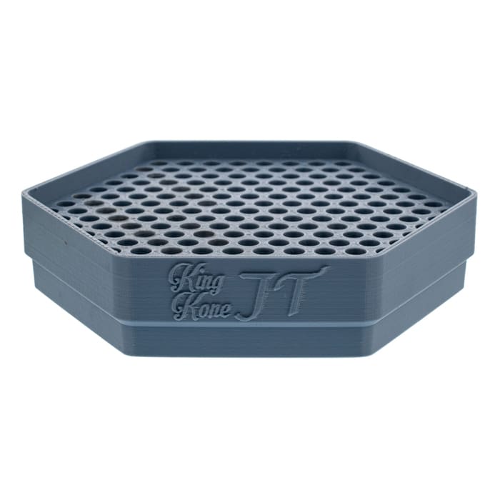 Gray hexagonal tray with holes.