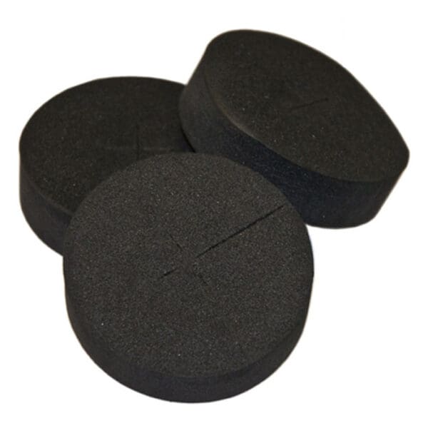 Three round black foam discs stacked together.