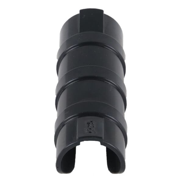 Black cylindrical plastic object with grooves.