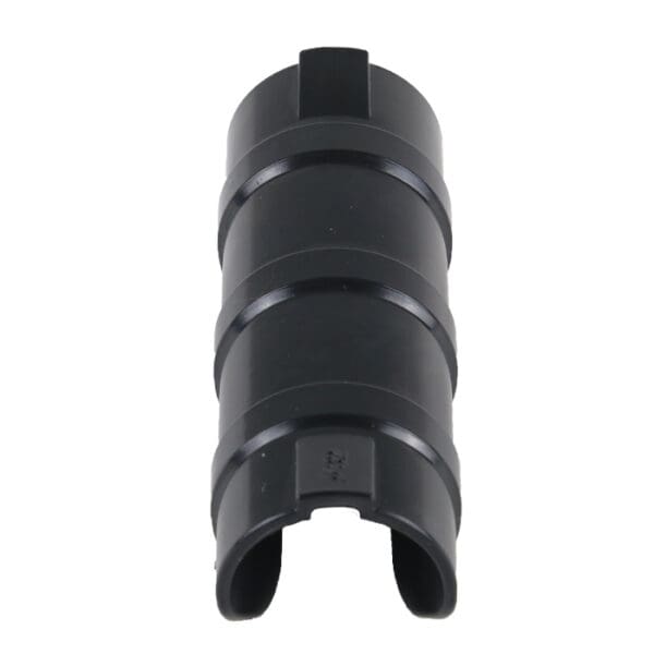 Black cylindrical rubber or plastic connector.