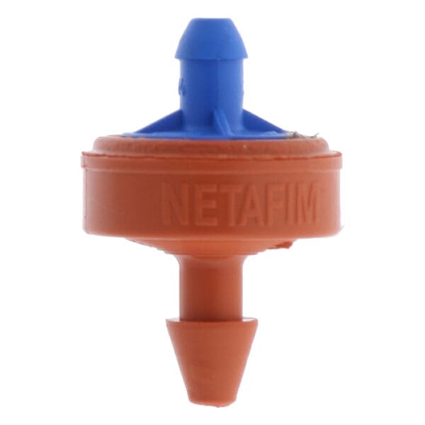 Netafim irrigation emitter in orange and blue.