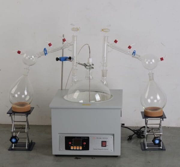 Lab equipment for distillation and heating.