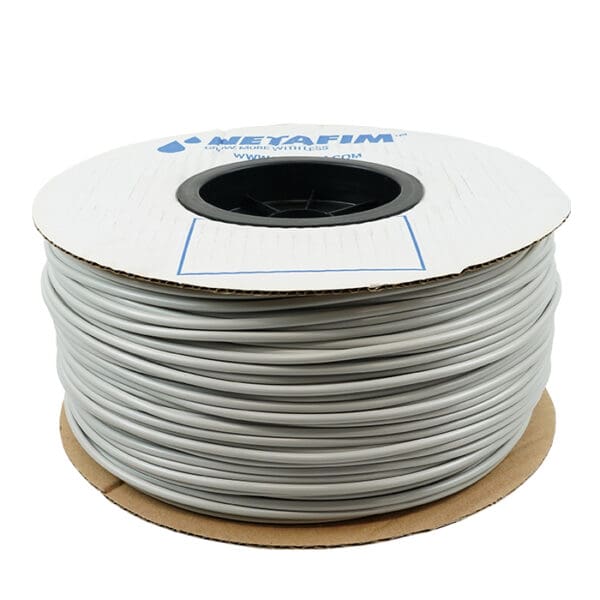 Grey plastic irrigation tubing roll.