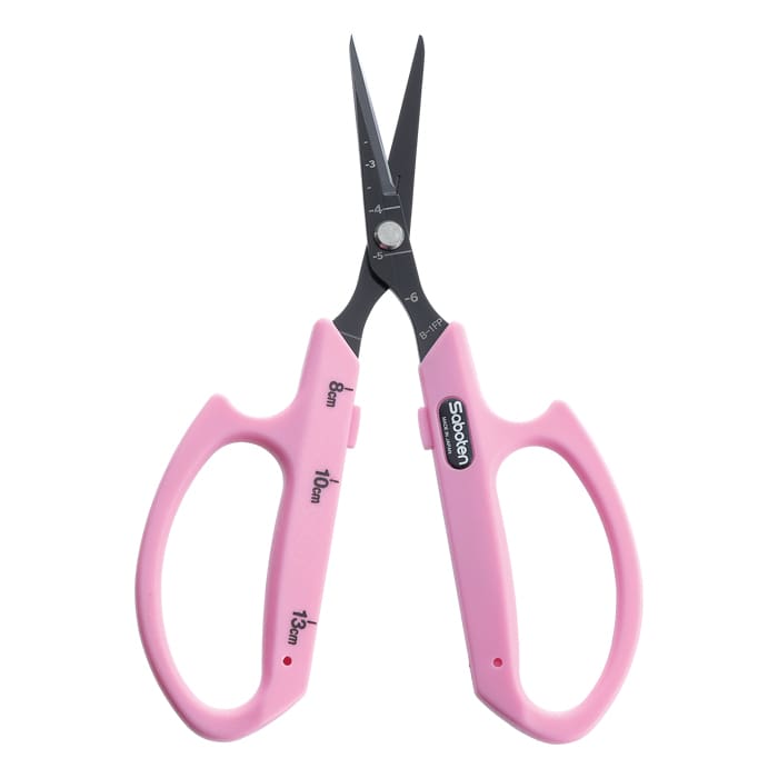 Pink scissors with measuring marks on sides.