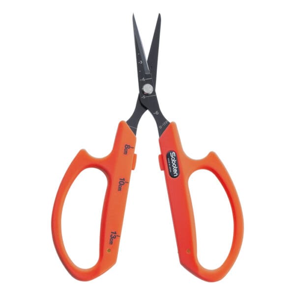 Orange scissors with black blades.