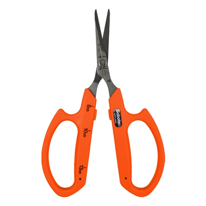 Orange scissors with measurement markings.