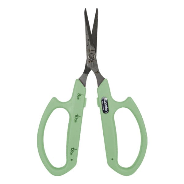 Green scissors with measurement markings.