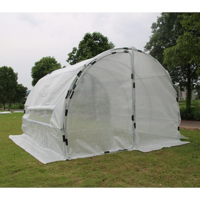 Greenhouse structure in an outdoor setting.