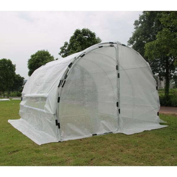 Greenhouse with a white mesh cover.