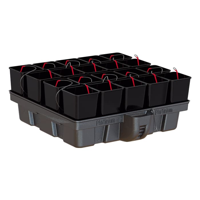 Black planting buckets arranged on a tray.