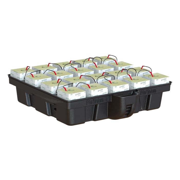 Battery packs arranged on a black pallet.