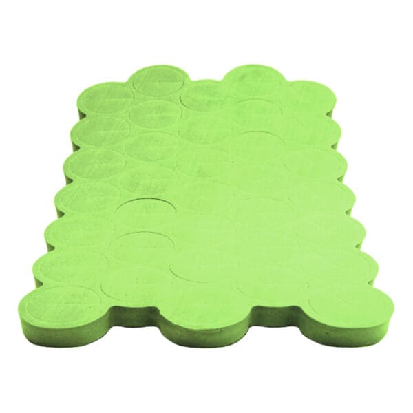 Green rubber mat with circular patterns.