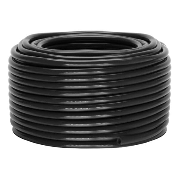 Black coiled tubing on a flat surface.