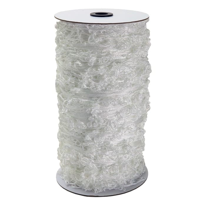 White decorative ribbon on a spool.