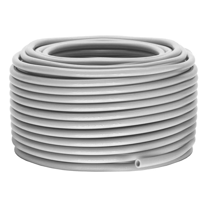 Coiled gray plastic tubing on white background.