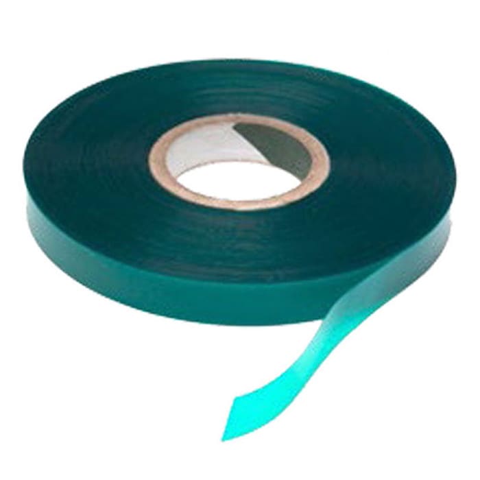 Green adhesive tape roll on white background.