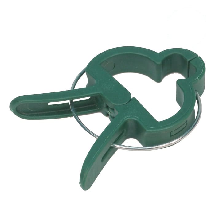 Green plastic clamp with metal ring.