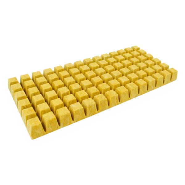 Yellow textured foam mat with cubed patterns.