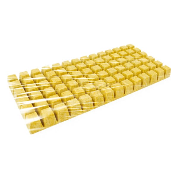 Yellow rectangular object with small cubes.