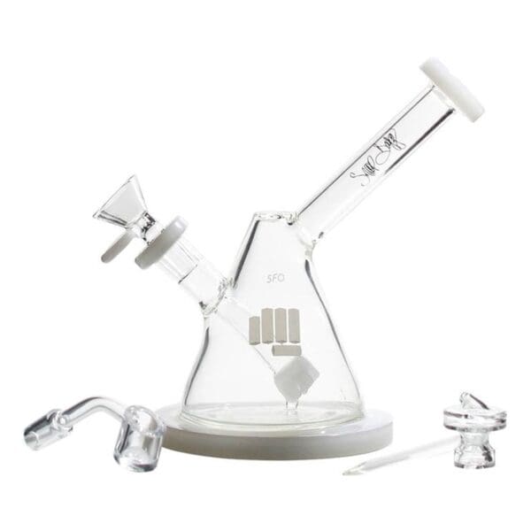 Glass bong and accessories on white background.