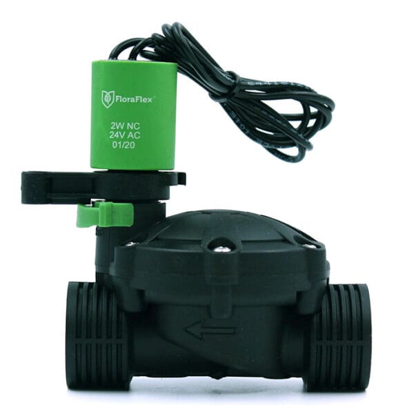 Electric solenoid valve with green actuator.