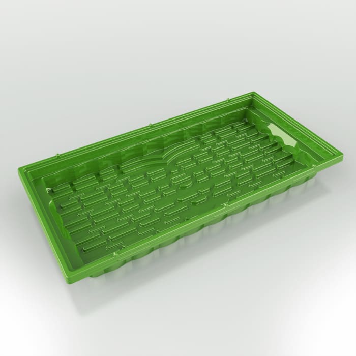 Green plastic maze tray on a white background.