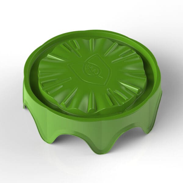 Green, circular plastic lid for container.