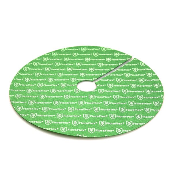 Green circular garden mat with logo pattern.