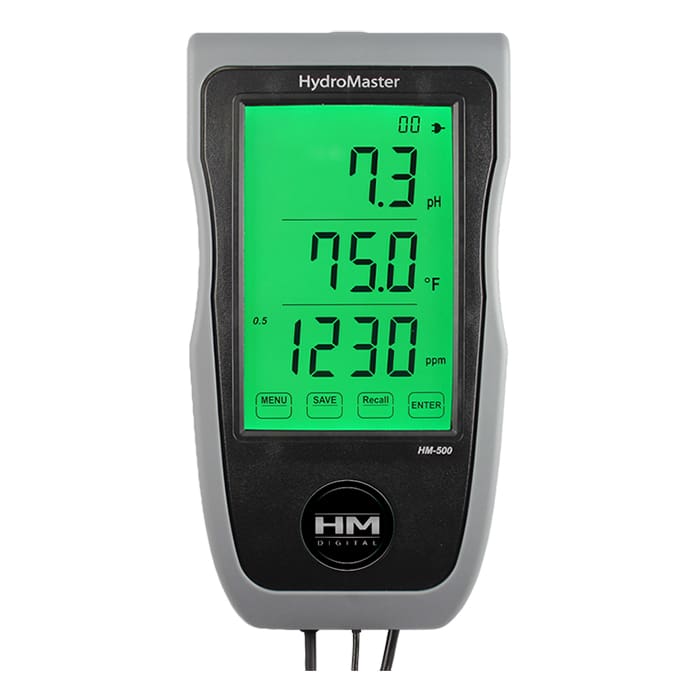 Digital water quality meter displaying readings.