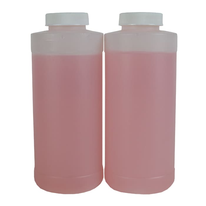 Two pink liquid bottles with white caps.