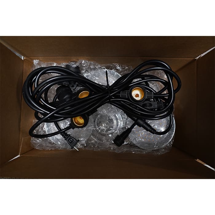 Black cables and connectors in a box.