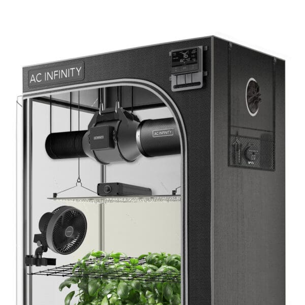 Indoor gardening setup with ventilation equipment.